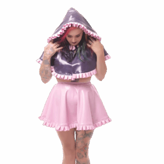 Model wearing pink latex skirt and purple latex hoodie cape – handmade latex clothing UK