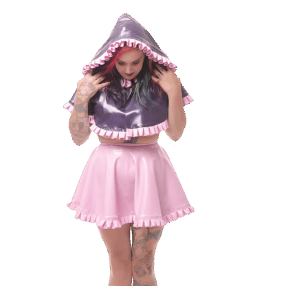Model wearing pink latex skirt and purple latex hoodie cape – handmade latex clothing UK