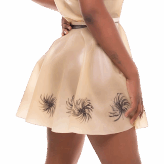 Model wearing Latex Rubber Dandelion Skirt in natural colour with hand-applied black dandelion motifs – handmade in London by Latexandlovers