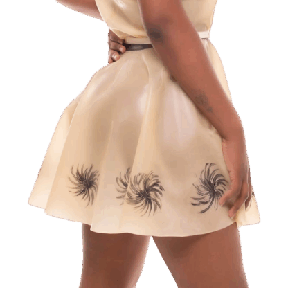 Model wearing Latex Rubber Dandelion Skirt in natural colour with hand-applied black dandelion motifs – handmade in London by Latexandlovers