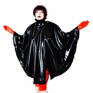 Model wearing Latex Cape ROBIN in black vegan latex with red gloves and skirt, featuring frilled edges, stand-up collar, and front snap closure